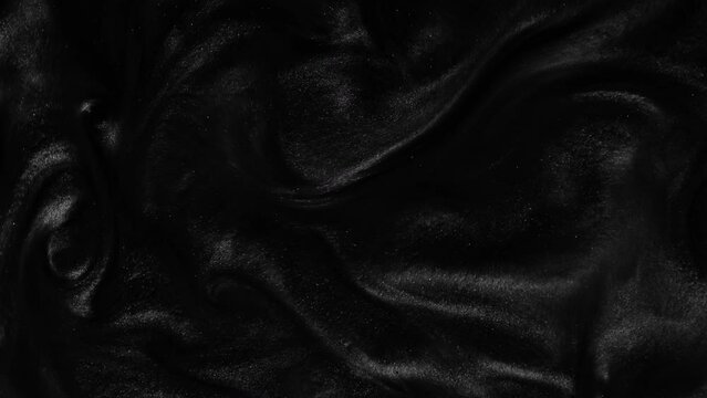 Liquid dark motion organic background. Shine glitter fluid metallic black color paint. Texture abstract acrylic cloud swirling underwater.