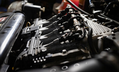 Fototapeta na wymiar Fuel system of a car engine. Repair and maintenance. Auto service.