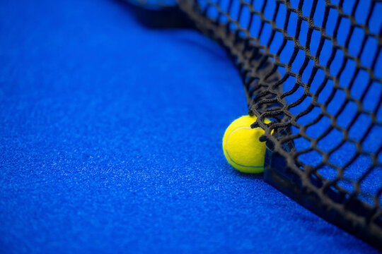 Yellow tennis and padel ball in court on blue turf. Horizontal sport poster, greeting cards, headers, website - Powered by Adobe