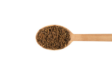 Valerian herb root on wooden spoon isolated on white background. Valeriana officinalis. used in herbal medicine as a tranquillizer and to treat insomnia, anxiety, hypertension, pain relief.