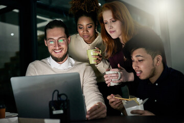 Discussion, laptop and business people in the office at night working overtime on a deadline project. Collaboration, late and corporate team planning company report together on computer in workplace.