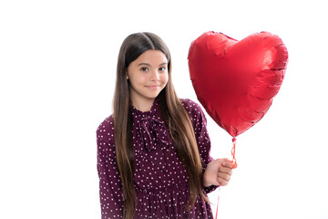 Valentines Day. Dreaming cute teen child with red heart balloon. Portrait of happy smiling teenage child girl.