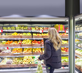 Woman buying fruits and vegetables at the market