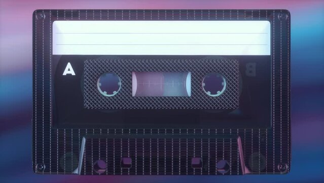 Rotating tape on an old vintage cassette. Retro music concept. Radio tape recorder, audio cassette