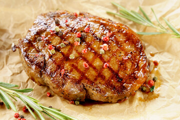 Fried steak close up, tasty, restaurant. Spiced with peppercorns and herbs