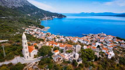 Enjoy the view of Croatia's beach from above, where turquoise waters meet soft sands. Relax and find adventure in this beautiful vacation spot, captured in stunning aerial photography.