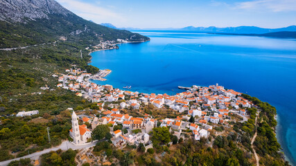 Fototapeta na wymiar Get lost in the picturesque scene of Croatia's beach, with its stunning turquoise waters and pristine coastline. From above, the aerial view showcases the perfect spot for a vacation and adventure.