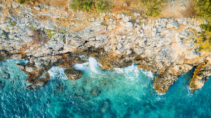 The stunning beauty of Croatia's rocks and forests is captured in this breathtaking aerial view. Take in the turquoise waters and beach from above, and add this travel image to your collection of unfo