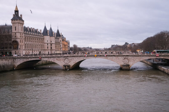 Evening photo of bridge over Seine river in Paris, France