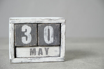 May 30 calendar made wooden cubes gray background.With an empty space for your text.