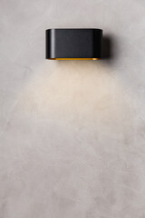 black wall lamp on gray wall copy space