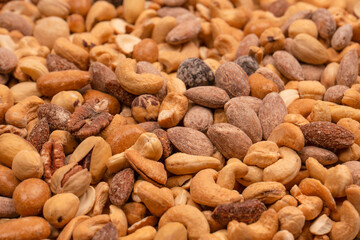 A group of almonds, pistachios, walnuts, macadamia, cashews.
