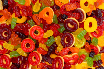Fototapeta na wymiar Assorted colorful gummy candies. Jelly donuts. Jelly bears.