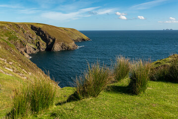 Scenic view of the green cliffs of Erris Head and the blue Atlantic Ocean, Mullet Peninsula, County...