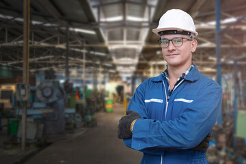 Portrait of manual man worker is standing with confident with blue working suite dress and safety...