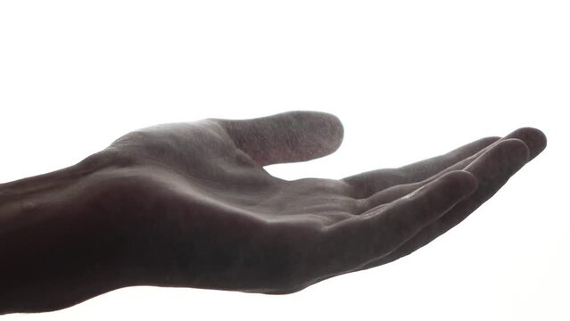 man sprays disinfectant on his palm on a white background. antiseptic. close-up.
