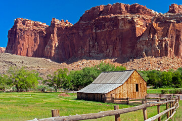 Multi-colored butte behind deserted ranch house near Grafton, UT.