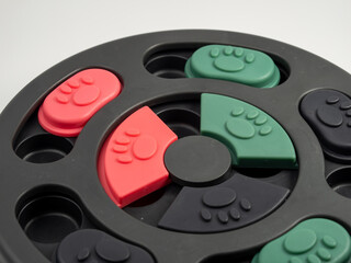 Intellectual game for dogs on a white background. Training game for dogs. Close-up.