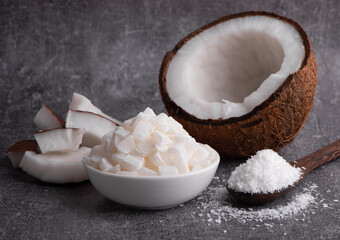 Whole coconut. Coconut shavings and coconut pieces. Fresh coconut.