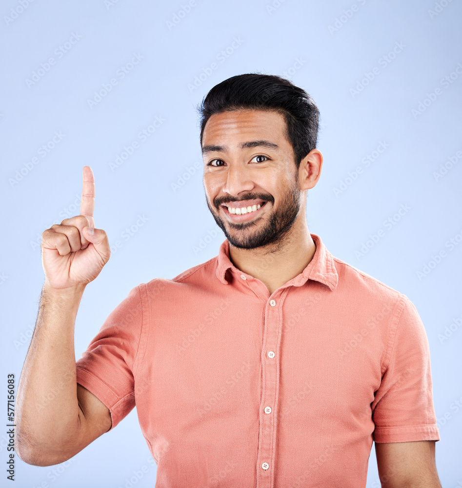 Poster happy, portrait and man pointing in a studio to mockup space for advertising, marketing or product p