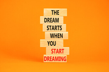 Start dreaming symbol. Concept words The dream starts when you start dreaming on wooden blocks....