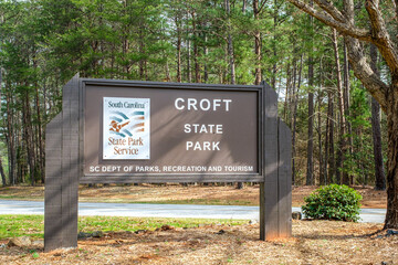 Croft State Park Entrance Sign against a green forest in Spartanburg, South Carolina in Spring 2023 - obrazy, fototapety, plakaty