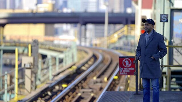 Man waiting for the subway train in New York - travel photography