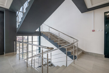 Fototapeta premium stairs emergency and evacuation exit stair in up ladder in a new office building