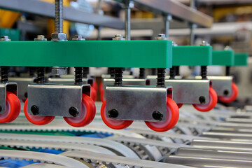 Colorful detail of an equipment fitted with belts and pulleys
