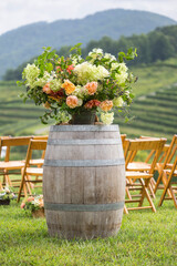 Rustic Wine-barrel flower arrangement at the ceremony. Wedding Decor