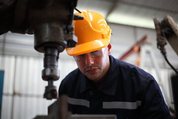 engineer checking auto parts in factory