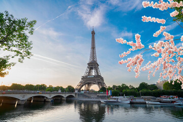 Fototapeta na wymiar Paris Eiffel Tower and river Seine with sunrise in Paris, France. Eiffel Tower is one of the most iconic landmarks of Paris, web banner format ar early spring morning