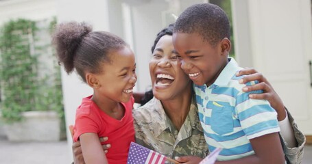 Animation of happy african american soldier mother and children hugging and embracing