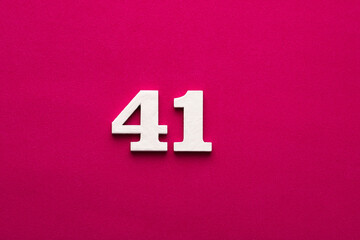 Number 41 - White wooden number on rhodamine red background