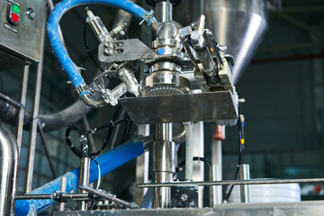 Obraz premium paint bottling line at the factory