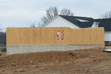 foundation and start of construction of a plywood house