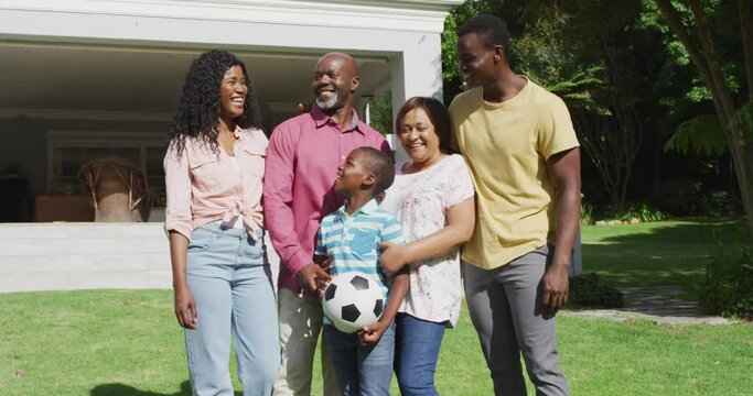Animation of happy african american family posing to photo in garden