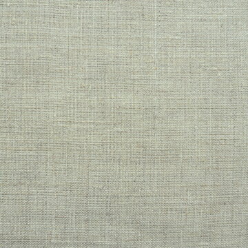 Fabric texture background. Light gray fabric with weave. Natural slightly wrinkled look of the material. Uniform copy space background. Cotton, canvas or woolen thin fabric laid evenly on the surface