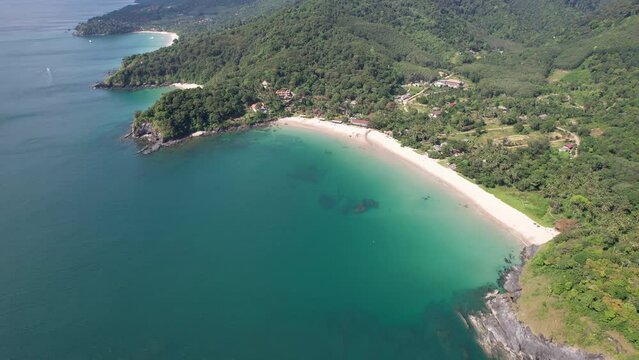 Slide drone footage of Khlong Chak beach on sunny day. Ko Lanta island, Krabi Province, Thailand.