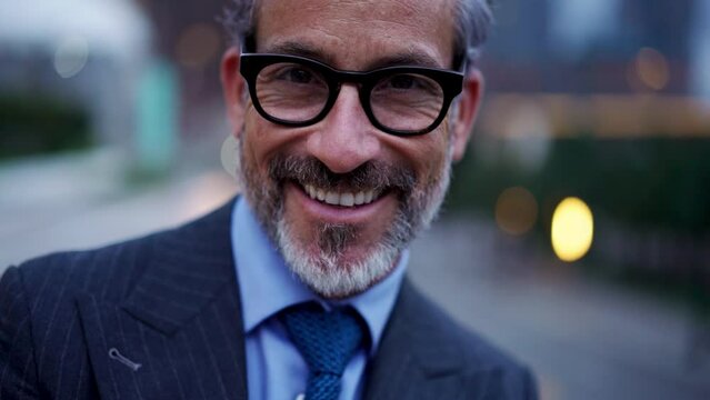Close up Portrait of Successful smiling business man in stylish suit and eye glasses with good thoughts, satisfied face posing for the camera. Happy and wealthy entrepreneur with beautiful features