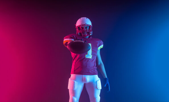 Horisontal banner for website header. Visual with American football player banner with neon colors. Template for a sports marketing with copy space. Mockup for betting advertisement.