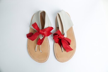 Obraz na płótnie Canvas ribbon leather traditional white and red sandals 