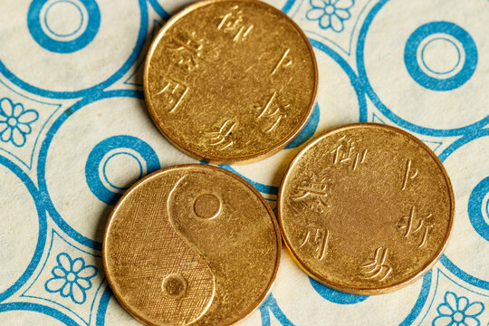 I ching ancient Chinese oracle, Book of Changes or Classic of Changes, with old coins