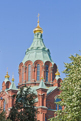 Fototapeta na wymiar St. Nicholas Orthodox Cathedral, with co[pper roof in Helsinki, Finland.