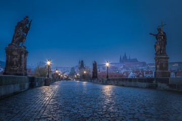 Obraz premium Charles Bridge, Prague at dramatic evening, Czech Republic, with night lighting