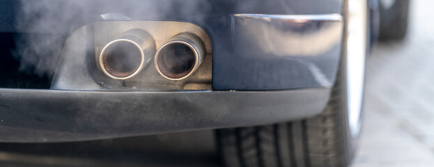 smoke from the exhaust of a car with a gasoline engine
