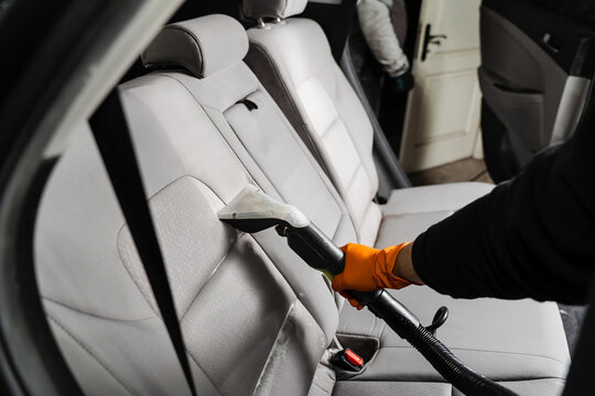 Line on textile car seat after extraction water and detergent of dry cleaning extractor machine. Dry wash cleaner is removing dirt and dust from car seat using dry cleaning extraction machine.