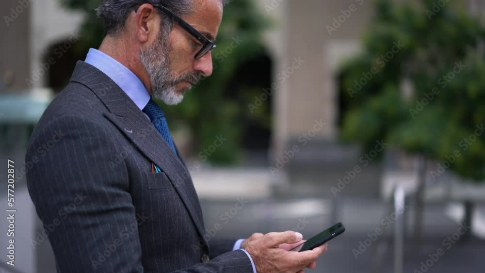 Poster successful man in expensive suit try to call on mobile phone device while waits answer. busy entrepr