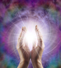 Reiki Master Healer sensing awesome vortexing energy field - male cupped hands reaching into a...