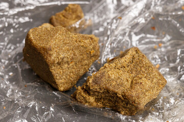 Detail of medical marijuana extraction hash cannabis pollen hashish, texture closeup